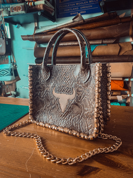 Embossed Python + Metallic Pink Skull Inlay